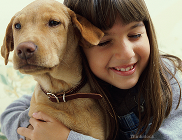 Girl Hugging Dog